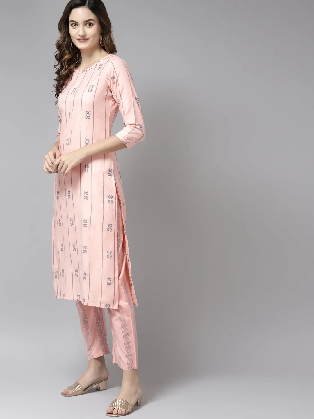 Women Peach Safe Design Yarn Dyed Kurta With Trousers And Dupatta Set